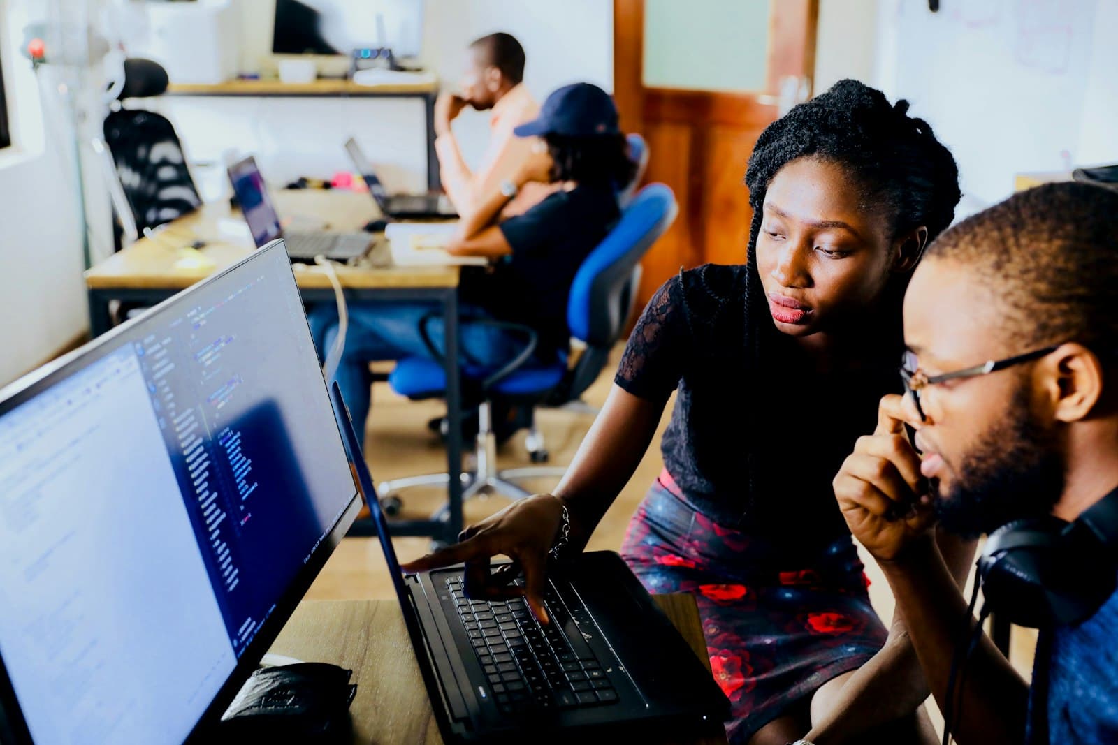 A social media team reviewing posts together
